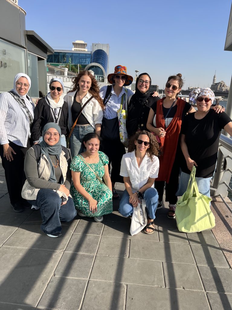 Participants of the Experimenting with Urbanity workshop pose for a group photo outdoors