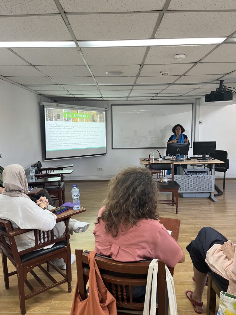 Participants seated in a classroom watch a presentation during the Experimenting with Urbanity workshop